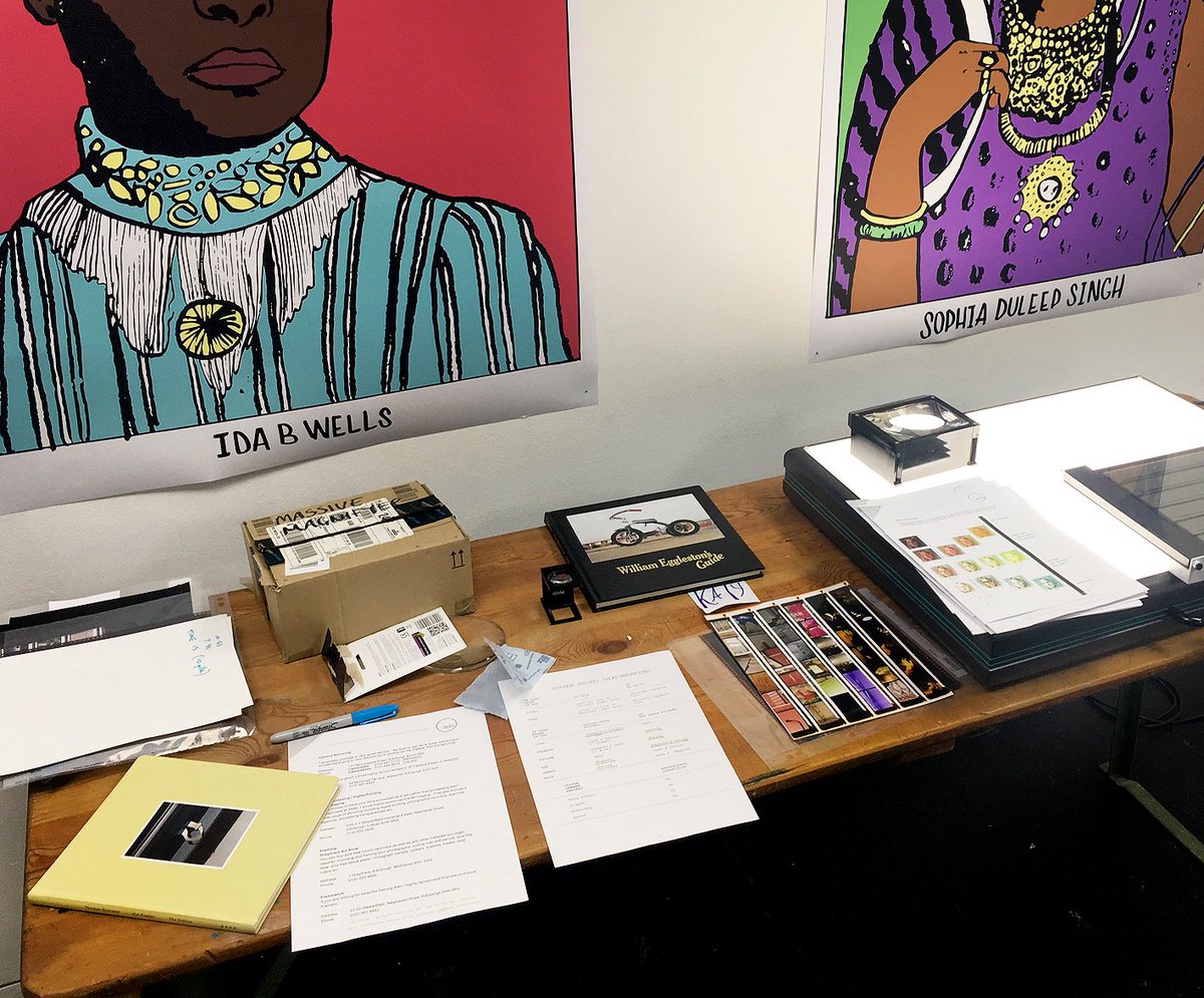 Photograph of worksheets, lightbox, contact sheets and books.