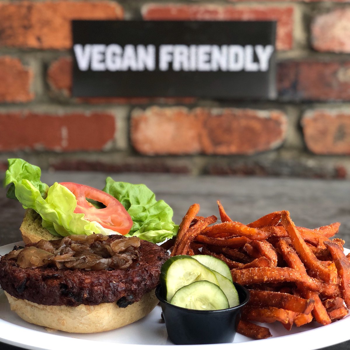 urbanstack's tweet photo. Vegan or not this homade black bean burger is easy for anyone to devour! Pair it with some sweet potato fries or check out the other options on our vegan friendly menu #urbanstack #veganfriendly #plantbased https://t.co/nM9XkkmD1n