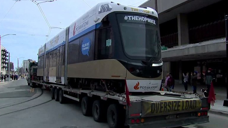 MayorMKE's tweet photo. It’s here. The first vehicle of the @MilwStreetcar has arrived. There’s still testing to be done for the next several months, but we’re looking forward to free rides starting later this fall. @thehopmke #THEHOPMKE https://t.co/vGOnBp14NN