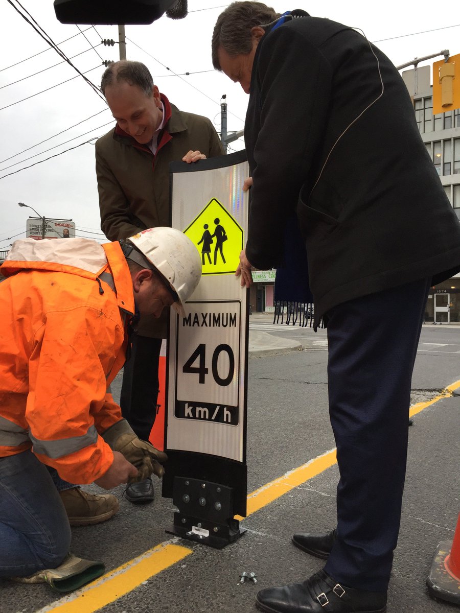 JohnTory's tweet image. This morning Councillor Colle &amp;amp; I installed the first in-road traffic-calming sign as part of a pilot to test improvements to road safety. We are installing these signs in 10 school zones across the city to remind motorists they are in a school zone &amp;amp; to slow down. #VisionZero