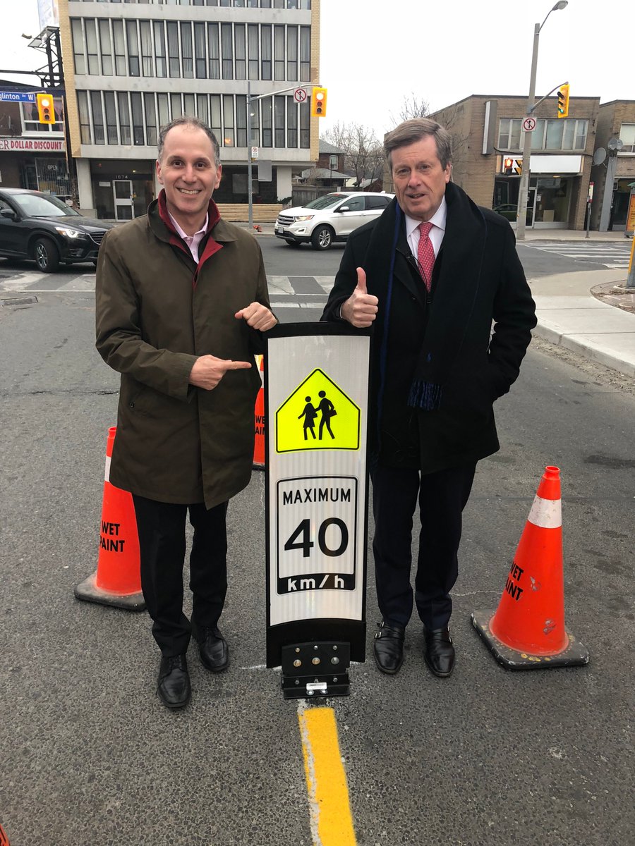 JohnTory's tweet image. This morning Councillor Colle &amp;amp; I installed the first in-road traffic-calming sign as part of a pilot to test improvements to road safety. We are installing these signs in 10 school zones across the city to remind motorists they are in a school zone &amp;amp; to slow down. #VisionZero