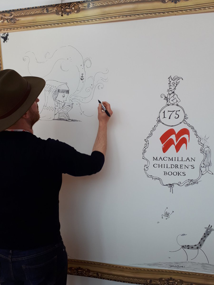 Here's @BenMMantle and his hat drawing #LittleRedReadingHood on the @MacmillanKidsUK illustrator wall @BolognaFiere #BolognaBookFair #BCBF18