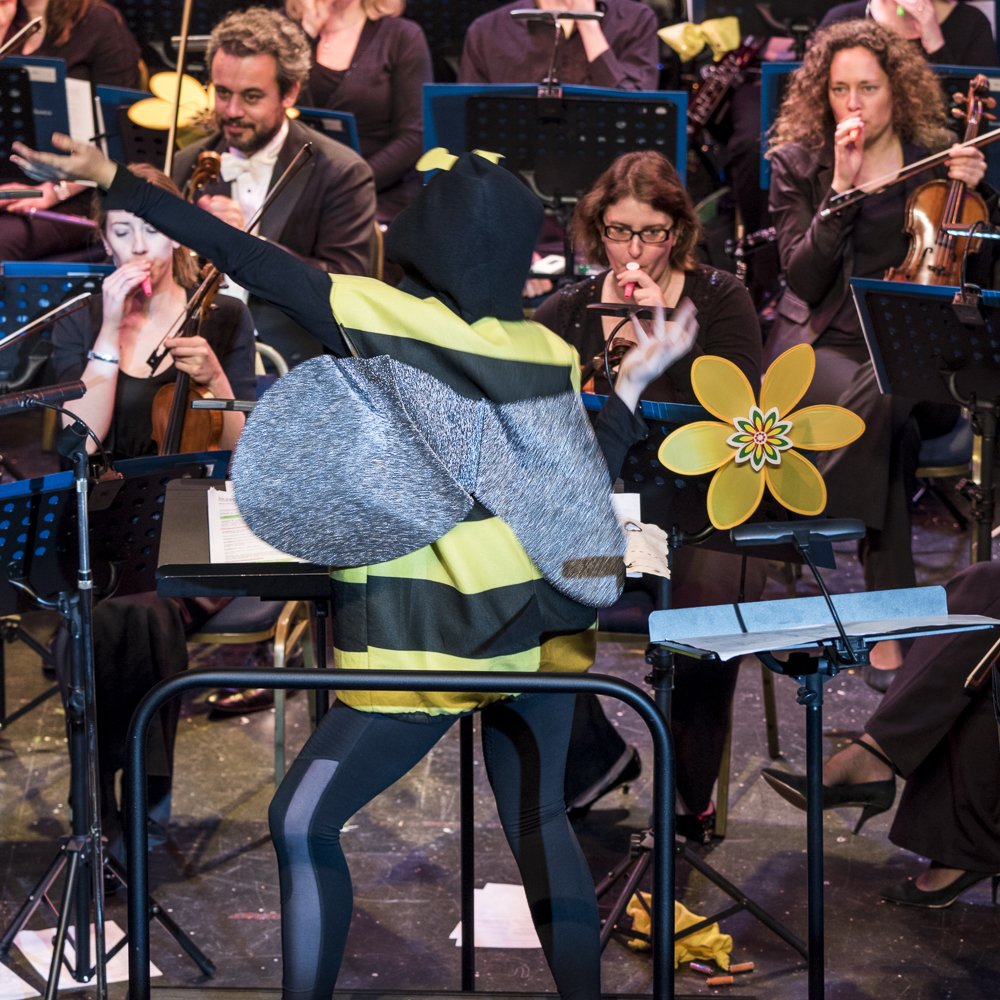 OrchestrasLive's tweet photo. Producing, presenting and even conducting the @rpoonline whilst dressed as a bee! Our Young Producers from @L6FC were busy on Friday with two schools concerts at @MarinaTheatre1 in our final few #OLSoundAround performances. Well done all! Photos by @ShowCapture https://t.co/DwmH6Oipee