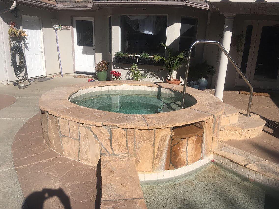 greenpowerincsd's tweet photo. This hot tub has a #flagstone finish, which unfortunately is crumbling and fading, as the material is not waterproof. On this project we are going with #Natural #fieldstone due to its #rustic look and water resilience 
#contractor #knowhow #homeimprovement #masonry #sandiego https://t.co/m1TxWer5g9