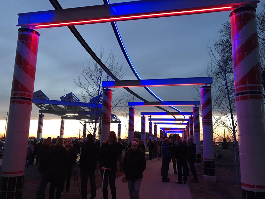 CityofWaukee's tweet photo. That is so lit! The #WaukeePergola is officially on daily from dusk to dawn. Dust off those bikes, and get out to the Raccoon River Valley Trail! Thanks for everyone who made it out for the ribbon cutting and to all who made this project a reality. https://t.co/Z6nWDHuB2A