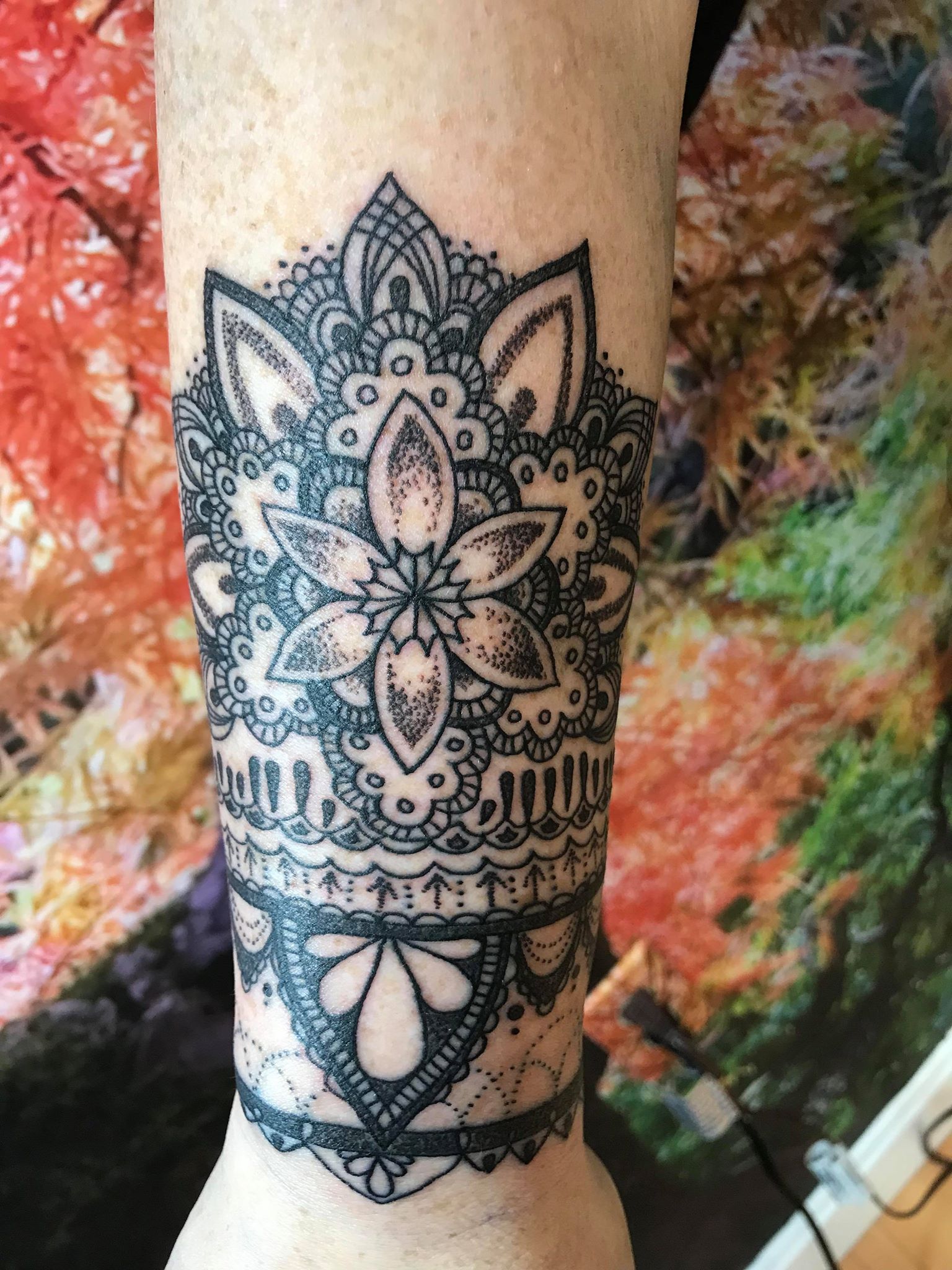 Lotus/floral wrist cuff tattoo by Nathan King in Asheville, at Thistle and  Pearl Tattoo : r/tattoos