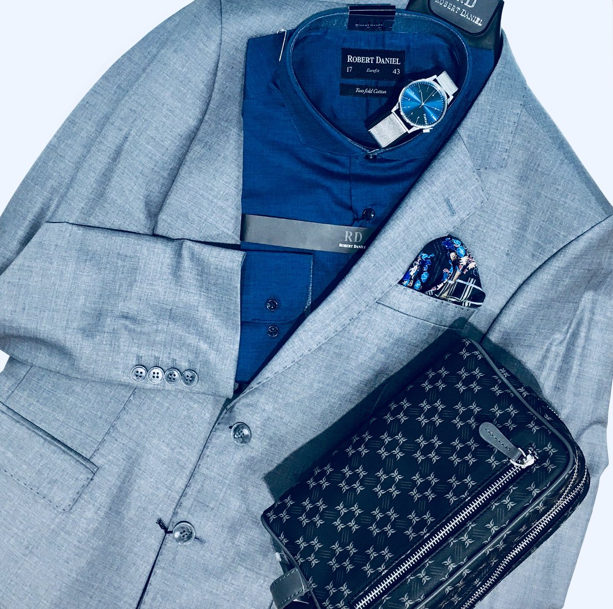 Our pick for the week! #lightgrey #suit #blue #shirt #leatherbag #pocketsquare #komonowatch 
Visit our #stylespecialists at <a href="/TheMallOfAfrica/">Mall Of Africa</a> &amp;  <a href="/VandAWaterfront/">vandawaterfront</a> #follow4follow #follow4style