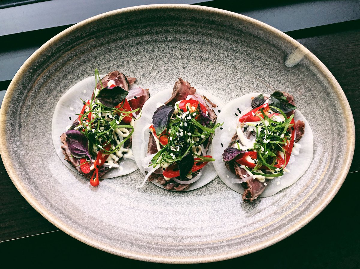 Beef Tataki Tacos! Triple seared &amp; marinated beef, beef fat &amp; yuzu aioli, pickled chili’s, and shiso, on a daikon.