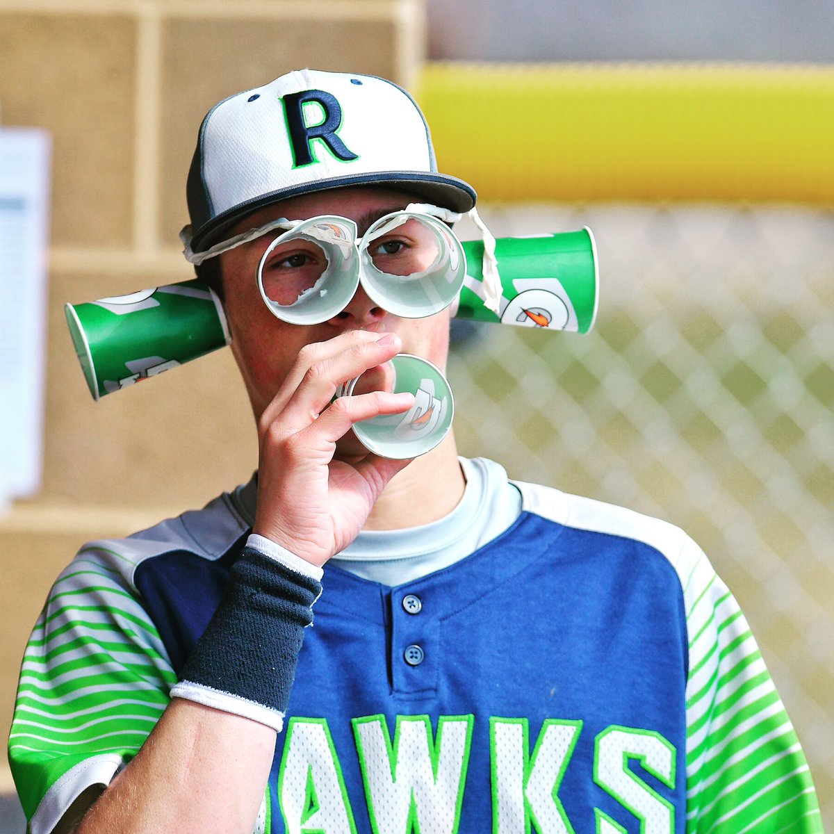 Ridgeline's Chance Parker cheers on his teammates as they play Sky View.