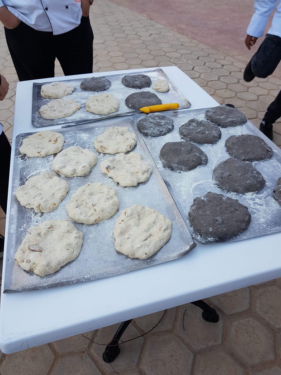 Two different types of traditional Tabouna bread created by the team! The left is golden sultana, hazlenut, and fig, and the right is squid ink and cranberry 🍞🥖 For more pics head to our #Facebook page 👩🏼‍🍳👨🏽‍🍳 <a href="/BakerTomsBread/">Baker Tom's Bread</a> #Tabouna #Tunisia2018 #baking #UKBakingTeam