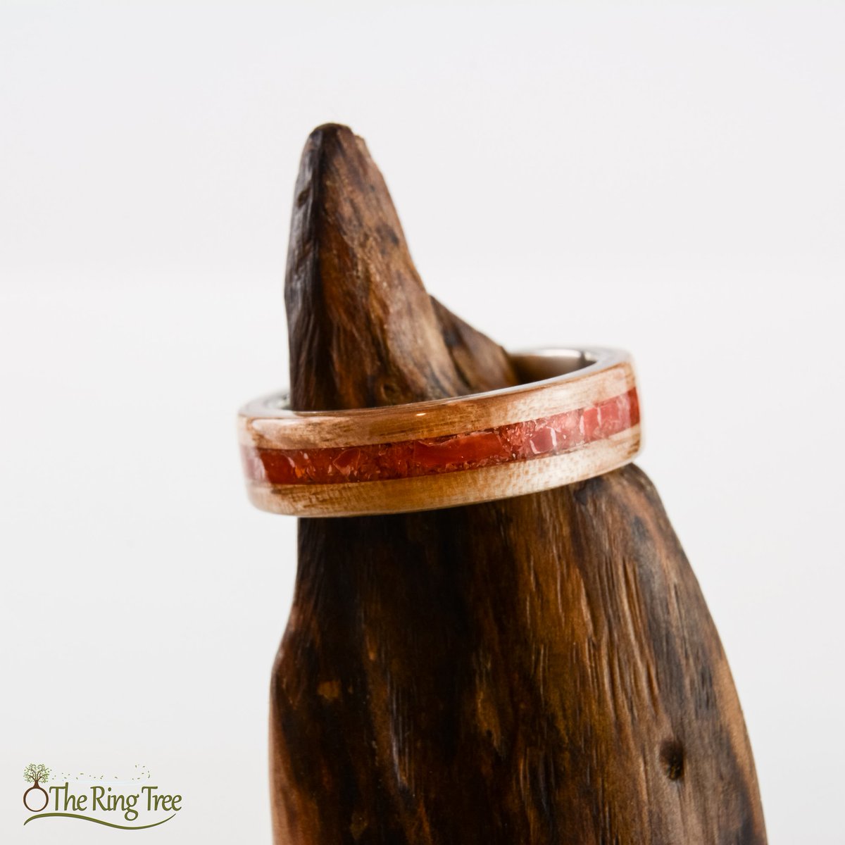 TheRingTree's tweet photo. This ring is sterling silver wrapped in live oak and inlaid with red coral. The live oak was recovered from a tree that fell in the 2004 Florida hurricane season. #TheRingTree #Bentwood #Silver #Coral #NaturalRing #WoodRing https://t.co/2X79z8KprK https://t.co/bKI49p1Wq6