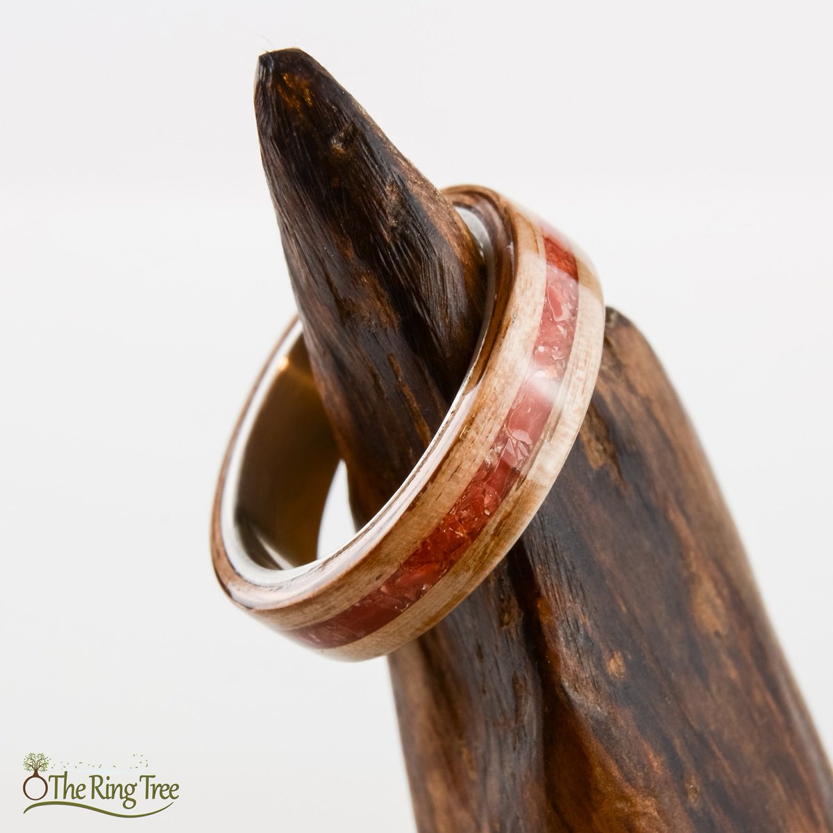 TheRingTree's tweet photo. This ring is sterling silver wrapped in live oak and inlaid with red coral. The live oak was recovered from a tree that fell in the 2004 Florida hurricane season. #TheRingTree #Bentwood #Silver #Coral #NaturalRing #WoodRing https://t.co/2X79z8KprK https://t.co/bKI49p1Wq6