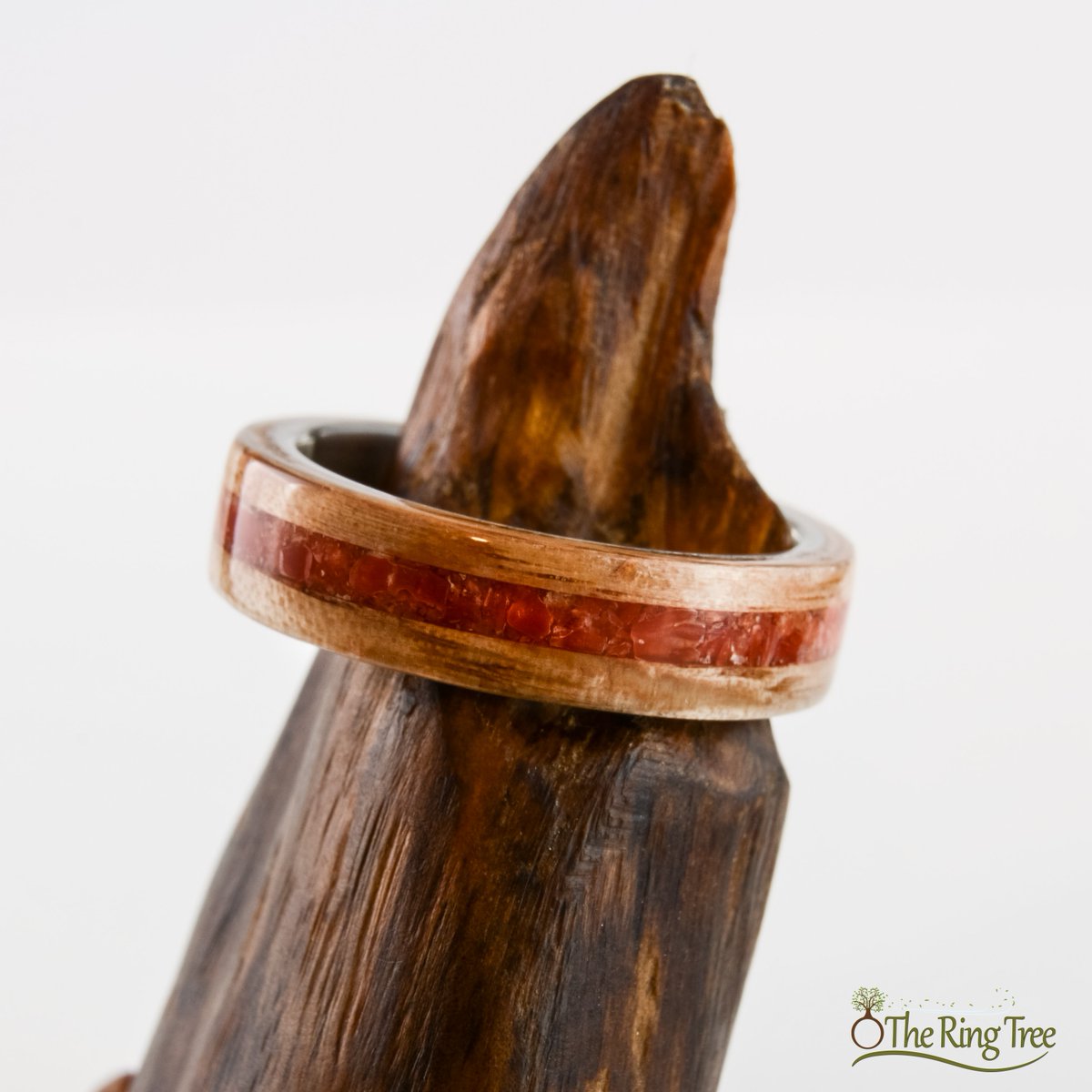TheRingTree's tweet photo. This ring is sterling silver wrapped in live oak and inlaid with red coral. The live oak was recovered from a tree that fell in the 2004 Florida hurricane season. #TheRingTree #Bentwood #Silver #Coral #NaturalRing #WoodRing https://t.co/2X79z8KprK https://t.co/bKI49p1Wq6