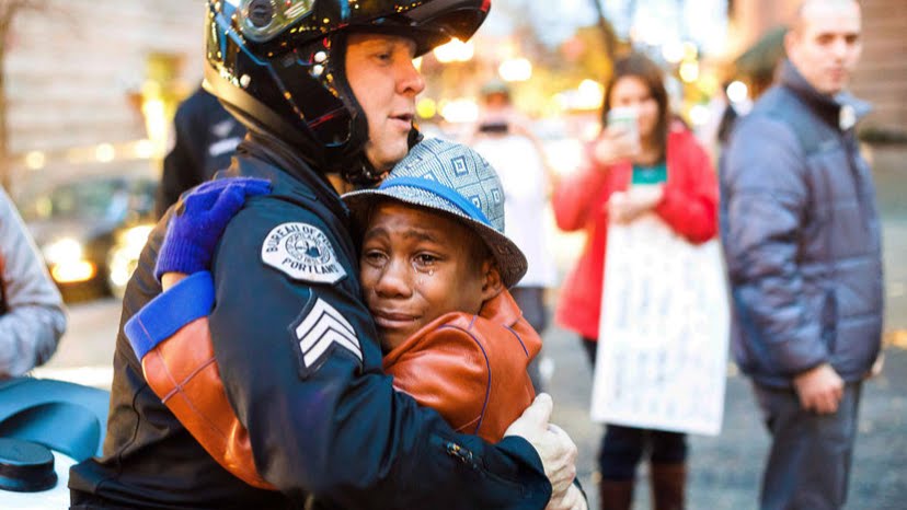 9NEWS's tweet photo. Boy who hugged officer in viral 2014 photo missing after parents, siblings die in crash https://t.co/99coYu0XmR https://t.co/kWxDsYl9rB