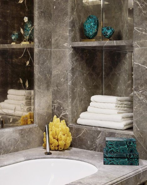 This is one of the bathrooms from our Ebury Square project. Creating built in shelves to display accessories or keep your towels on is a great way to utilise a smaller space.