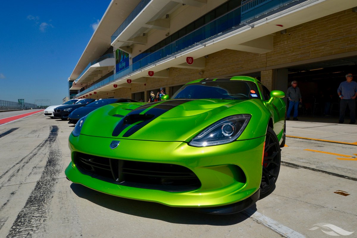 COTA's tweet photo. Supercars for a super cause. It's a beautiful day down on pit lane for #RideDriveGive benefiting the Travis County Center for Child Protection. https://t.co/yKSE4nkTyM