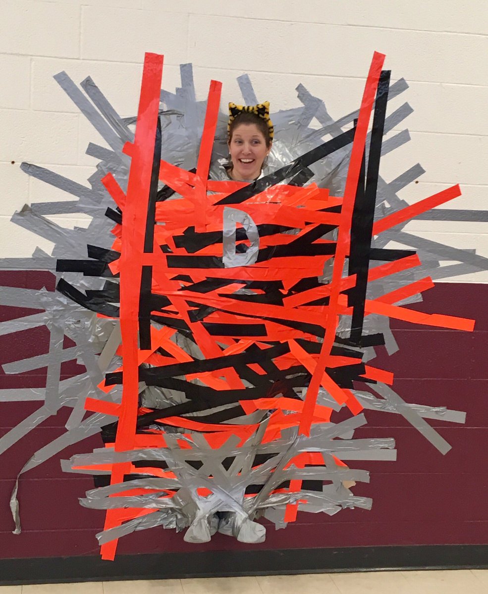 mrs_norland's tweet photo. Students & staff taped Mrs. Hafer 2 the wall for our Dawson HERO fundraiser. $1300 was donated 4 the pbis program. #apspride #apsdawson https://t.co/mU4ORlILPN