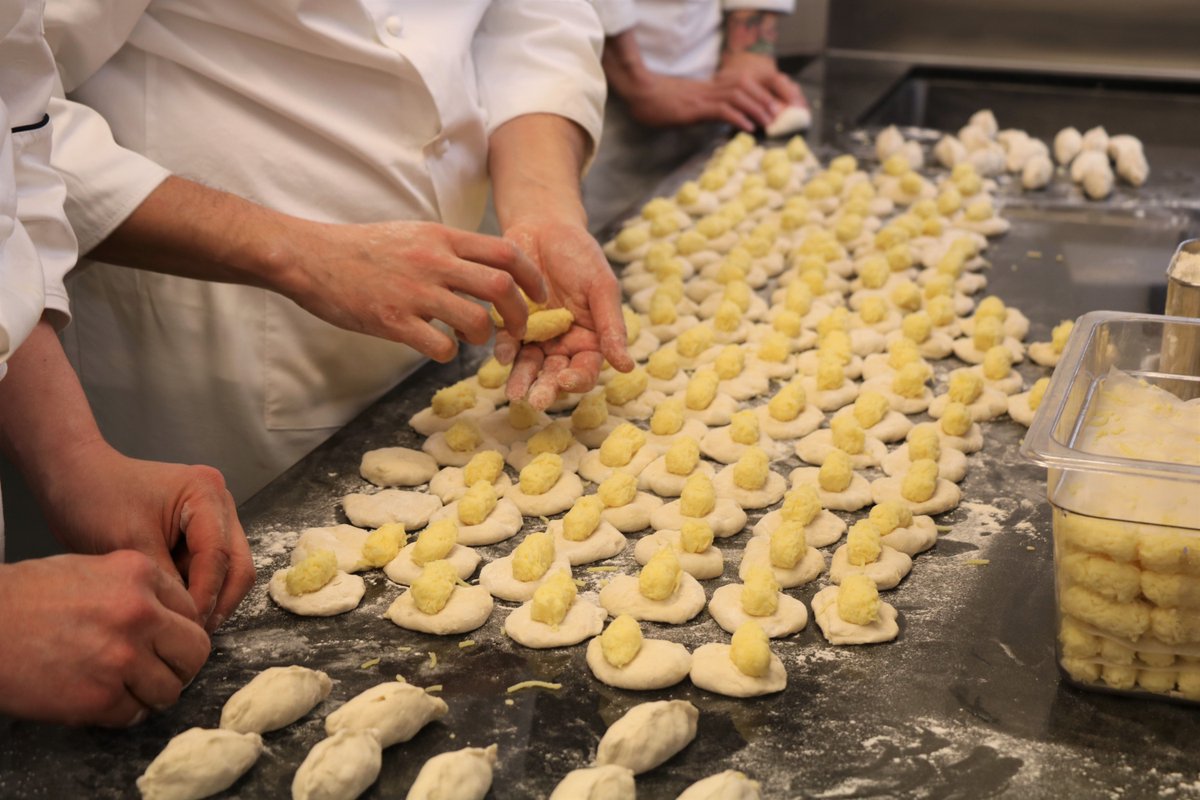 Behind the scenes in the L’ATELIER kitchen: comté cheese bread prep by Head Baker Tetsuya Yamaguchi and team. (<a href="/JoelRobuchonUSA/">Joël Robuchon USA</a>)