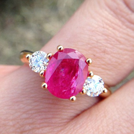 Ruby Diamond Engagement Ring with Accent Stones unusualengagementringsreview.com #ruby #red #white #three #oval #round #diamond #engagementring #engagement #ring #weddingring #wedding #accent #stones #therock #black #white #asian #latina #hispanic #indian #worldwide #strong #woman #women