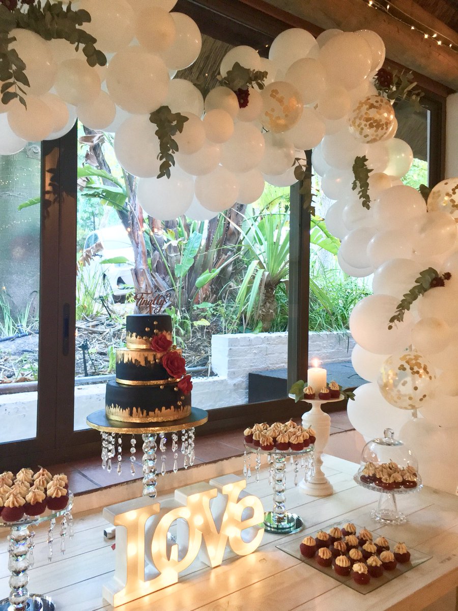 Dessert Table setup for the Winning Couple from last year’s Zevenwacht Wedding Fair @ZevenwachtWines #weddingdesserttable #winningcouple #weddingfair #balloongarland #weddingcake #weddingcupcakes #styleddesserttable #zevenwacht #capetown #capetownsouthafrica #eldsa