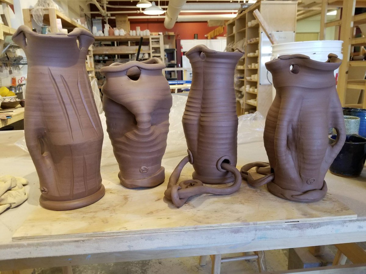 Funky hanging planters ready to get bisqued.