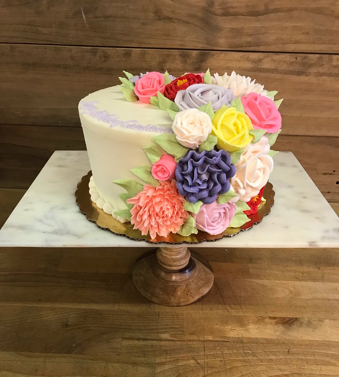 SweetTBakeshop's tweet image. 🐰Happy Easter! Smooth buttercream cake with #springflowers cascading down the front!🌺🐣 #eastercake #springcake #buttercreamflowers