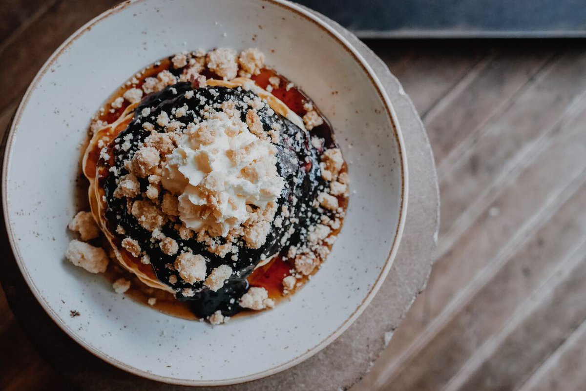 Hungover? We've go the remedy for you. Our Blueberry Pancakes are stacked with blueberry preserve, maple syrup, whipped cream and shortbread crumbs.
