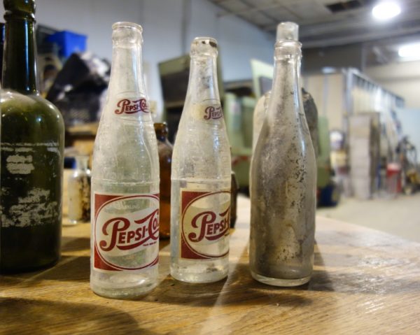 Torontonicity's tweet photo. These #Toronto tradespeople waterproofing homes found valuable century-old glass bottles: https://t.co/mdgyEZXtqE https://t.co/LMT7zAJhEU