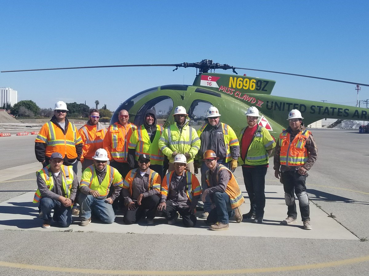 G3Quality's tweet photo. G3's Aaron Laughlin shares a photo op with Griffith on the Compton-Woodley Airport Runway job with LA County Department of Public Works. #TheG3Way #G3IntheField https://t.co/p7Xs9Pg5uF