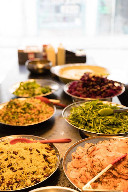 Plantkind_UK's tweet photo. So many colours! Pop in tomorrow for many options including our daily street food special, freshly prepared falafel boxes and our chocolate fudge cake - all #plantbased #Vegan 💚 https://t.co/MuLM9wTIyb