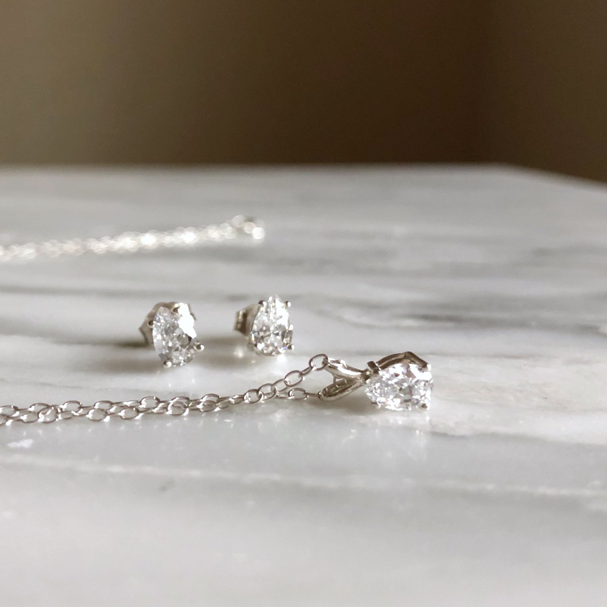SilverSculptor's tweet photo. CZ pear earrings and matching necklace ready to buy at @ShopLoveLocked https://t.co/0vHcvjwdWE