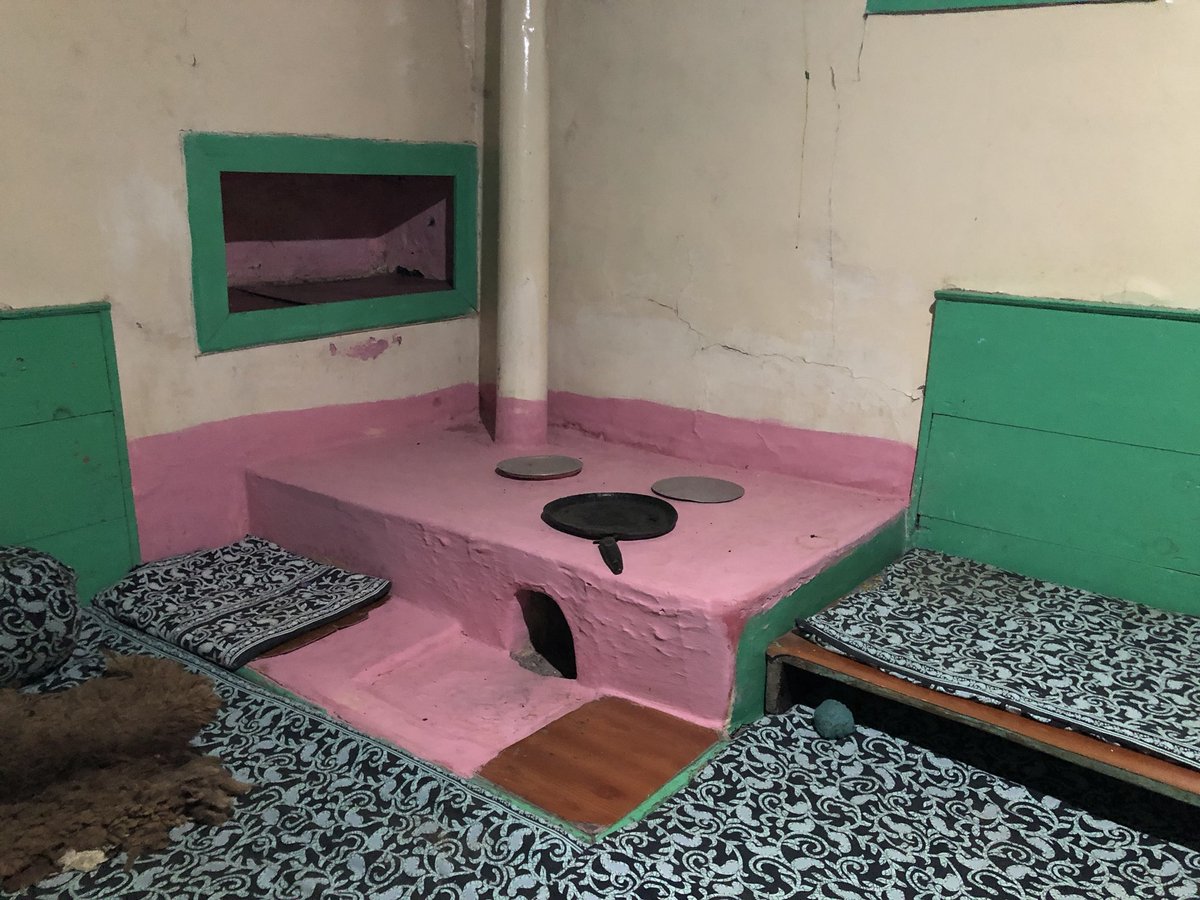 Pink & green! This quaint little kitchen of a 75-year-old house in an apple orchard in Jubbal, HP. The family now uses the newer modern kitchen but have restored (beautifully) this old one. That pipe serving as a chimney, lovely. Covered floors & seating cos very harsh winters.