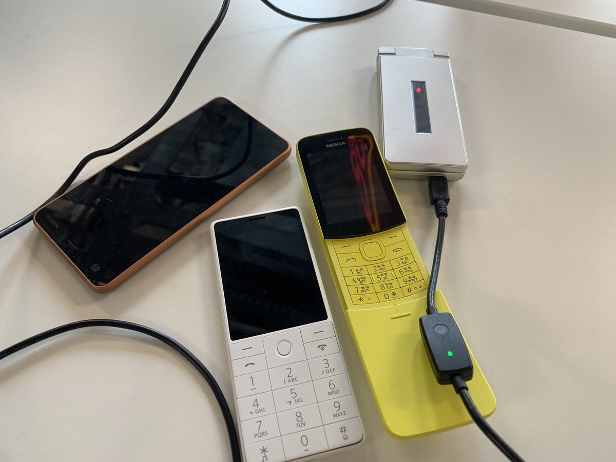 4 phones on desk