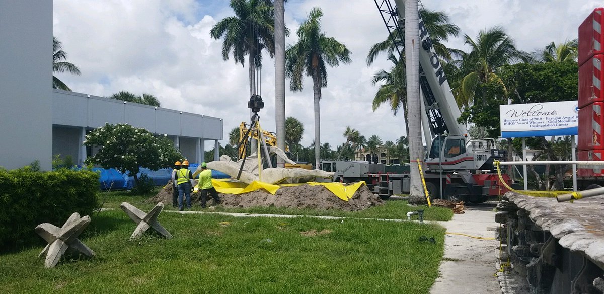 Our <a href="/FTLCityNews/">City of Fort Lauderdale</a> Aquatic Center project team temporarily removed the 14,001 lb Swimmerman statue in front of the <a href="/ISHOF/">ISHOF</a>. The team carefully removed it from the original base and placed it on a dirt bed while a new base is cast 100 fet from the original location.
