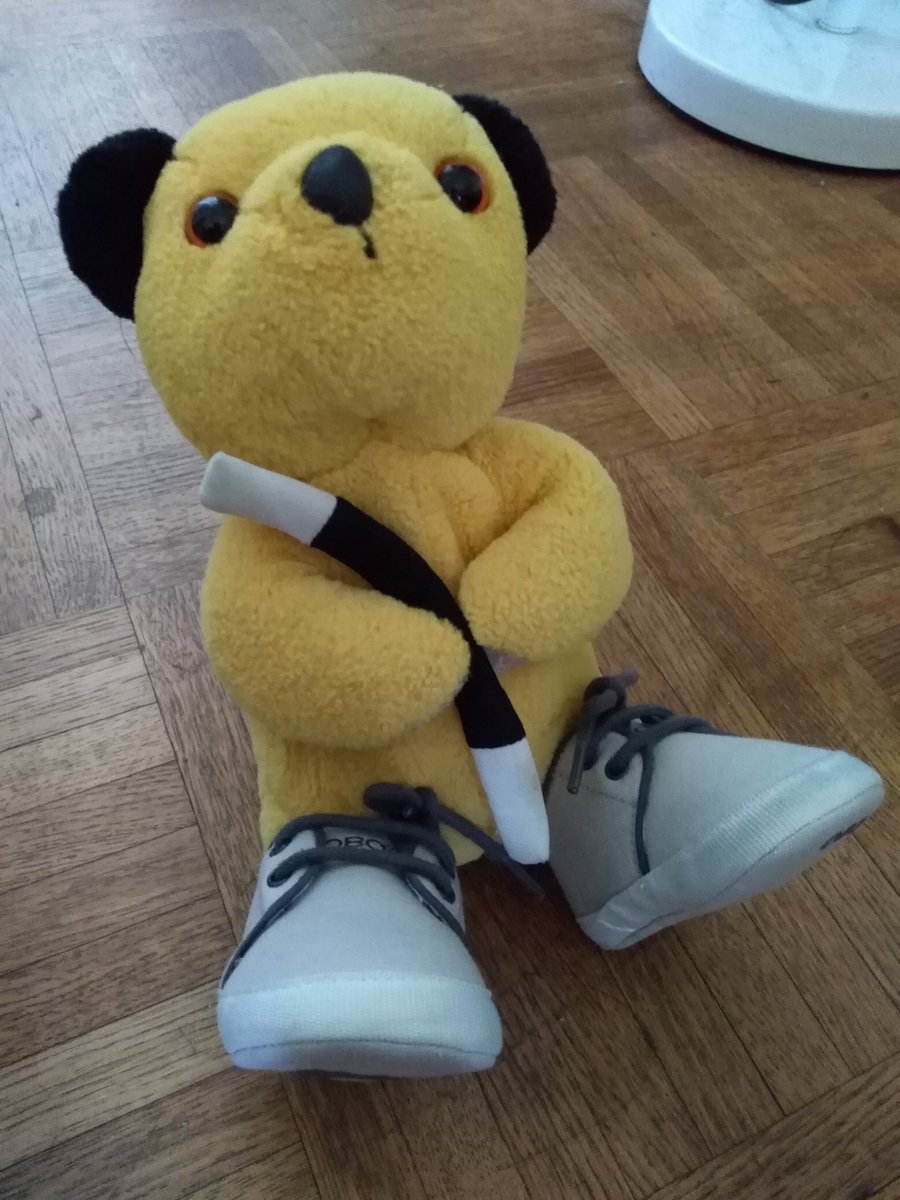 I'm trying on my little friend's shoes for fun. They're a bit too big for me! But they're very comfy.