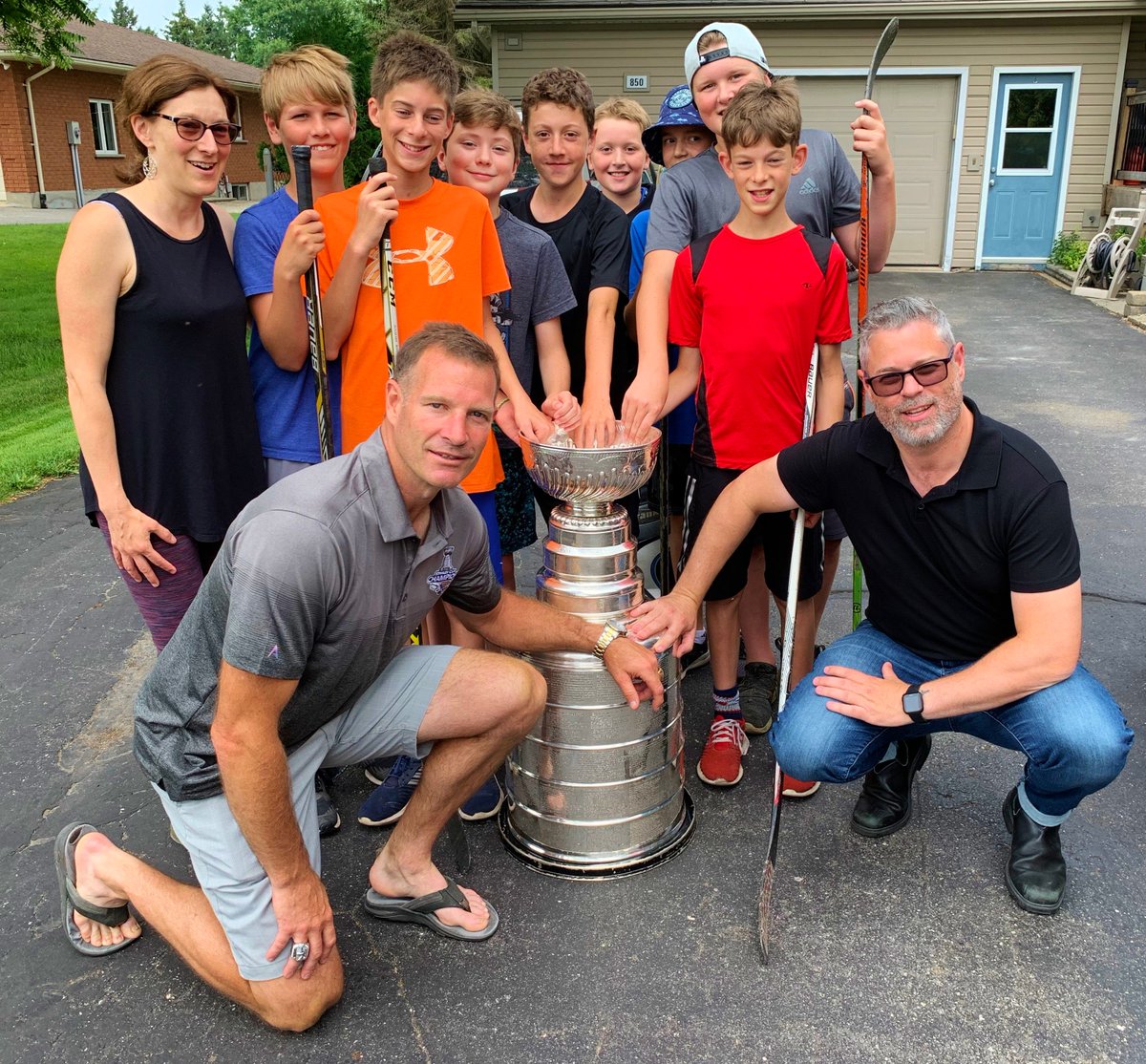 thebeaconherald's tweet photo. Tim Taylor wanted a low-key day with the @StanleyCup in @StratfordON Thursday afternoon, but first he decided to surprise a group of road hockey players by bringing hockey's holy grail to their driveway during a game https://t.co/DyZze9nZrV @StLouisBlues https://t.co/cua16AYErN