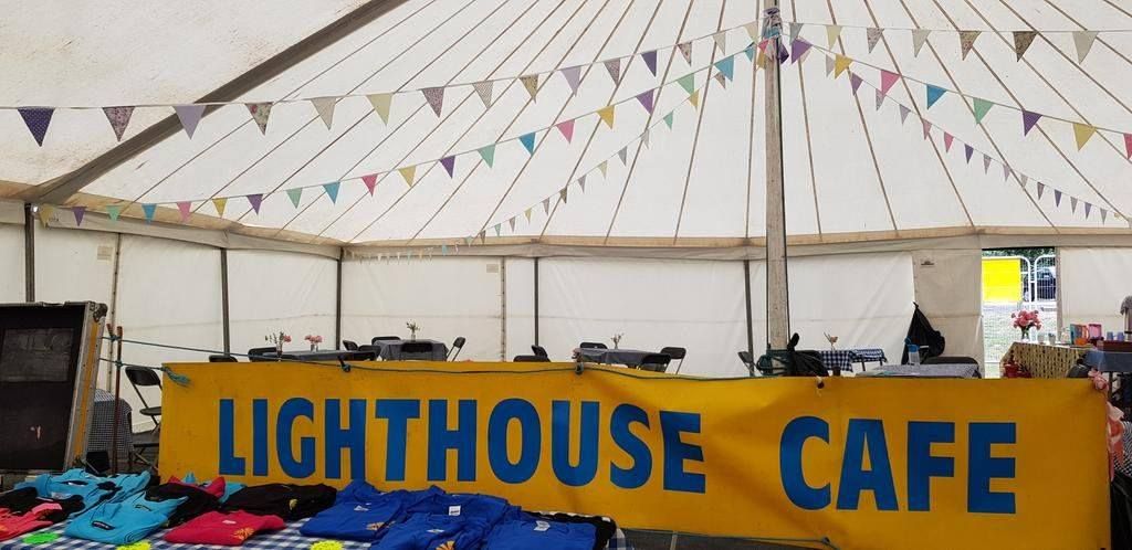 Lighthouse_GM's tweet photo. The Lighthouse cafe is open on the Buryfield site in the entrance tent all week! Serving up fabulous cakes and hot drinks. Everyone welcome to join us to enjoy a break and a slice of cake! #TimeForCake #Yummy #Cafe #LH2019 #WeAreFamily #FamilesEatTogether https://t.co/GMNEvIHuQL