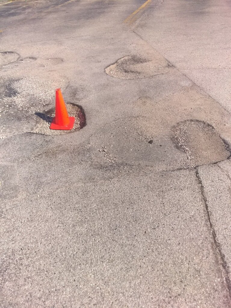 DLC2315's tweet photo. Parking lot at Mundelein, IL for #USPS is a minefield.....caution when driving through there!  Been this way for months! https://t.co/0rSQTCfD5R