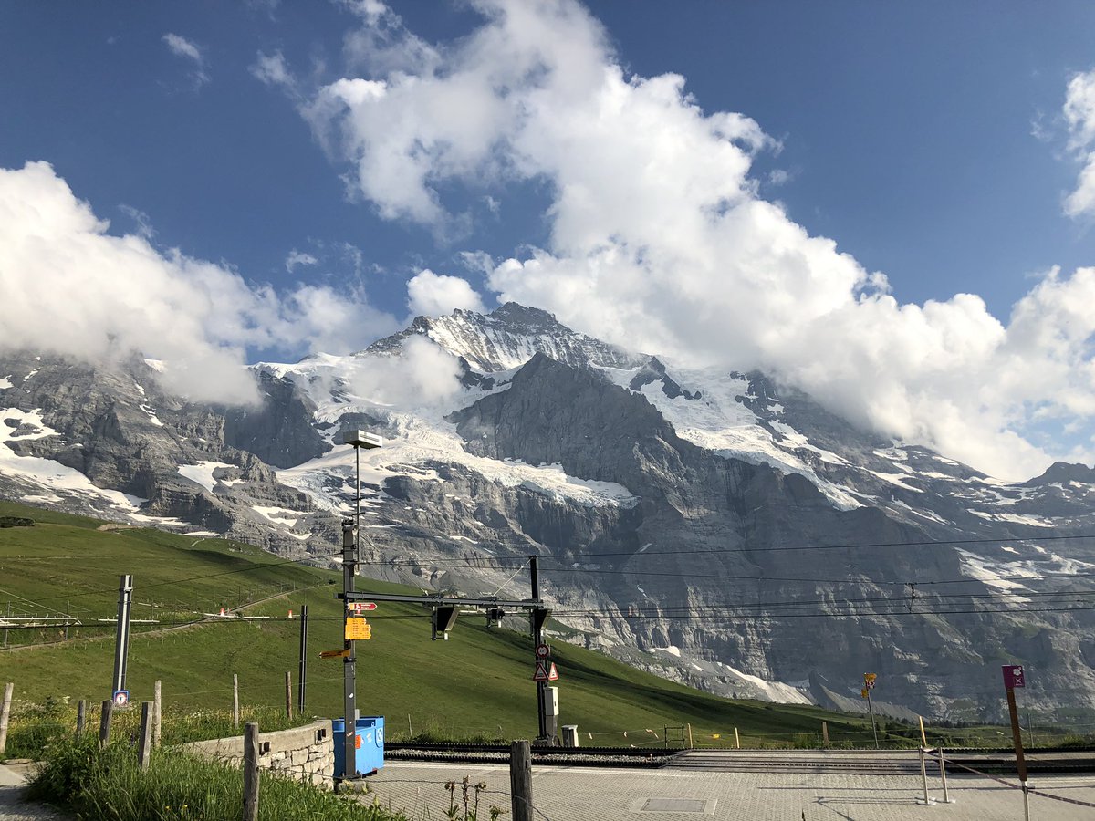 blainelasher's tweet photo. I could sit here all afternoon enjoying this view. Waiting for the train at Kleine Scheidegg, Switzerland back down to Lauterbrunnen. We took the train earlier today to Jungfraujoch, the highest rail station in Europe, near the summit of Mt. Jungfrau....the Top of Europe. https://t.co/1cry9DLl4u