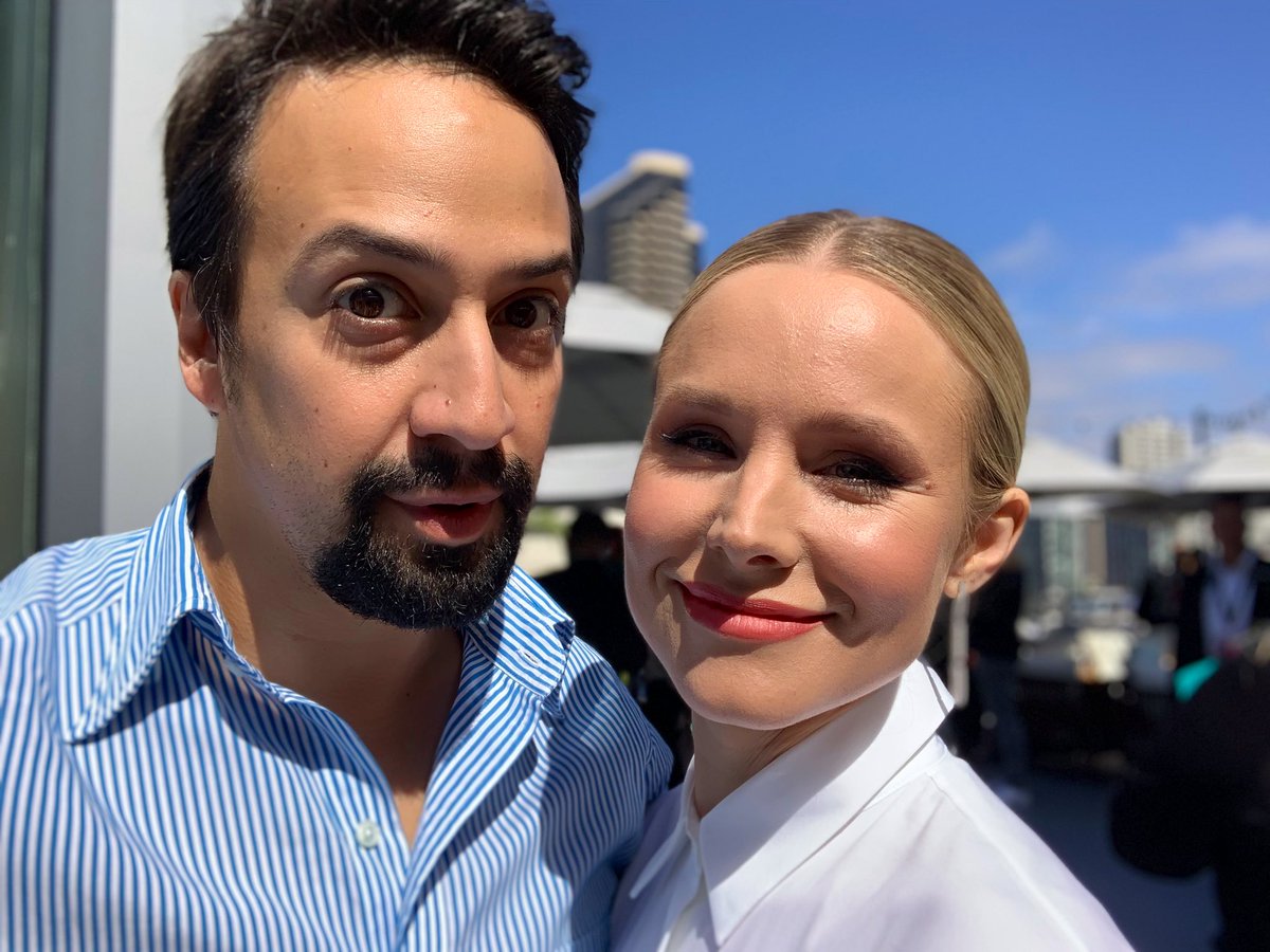 Lin_Manuel's tweet photo. I don’t know if you’ve ever seen two total strangers scream “I Love You!!” at each other across a crowded room but this is the picture we took right after we did that. 
@IMKristenBell #SanDiegoComicCon2019 https://t.co/4jCriLD2Be