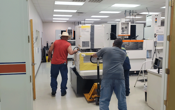 gagemaker's tweet photo. This morning we got our new @FANUCAmerica Robocut α-C400iB delivered. This new wire EDM will increase our capacity so we can shorten those deliveries and get the gages you need faster. Now we just have to set it up! Let's get to work!🛠️💯👏👍 https://t.co/sPEqoWSOwZ