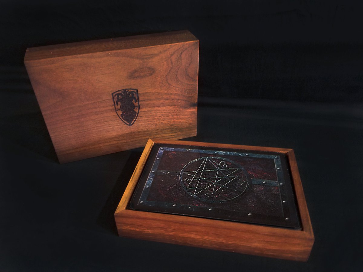Aeon_Tabletop's tweet image. The Cthulhu: Age of Madness Card Game! This is an early prototype of the collectors edition box. Made of Walnut hardwood. This will be an option in limited amounts for our kickstarter when it goes live. #cthulhu #cthulhumythos #tabletopgames #tabletopgaming #cardgames