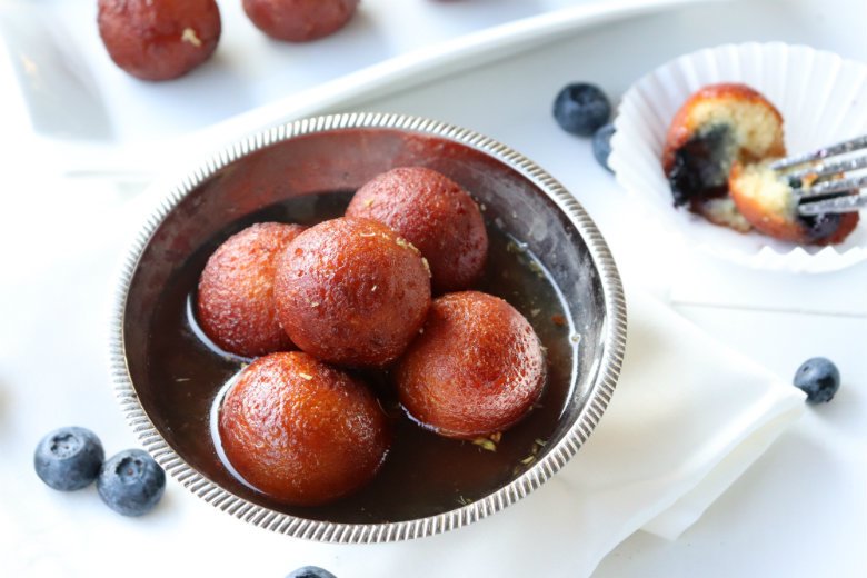 Gulab jamun is a very popular Indian sweet. They are bitesize round dessert soaked into cardamom sugar syrup with rose water till it is perfectly soft and juicy.For full recipe check royatoday.com