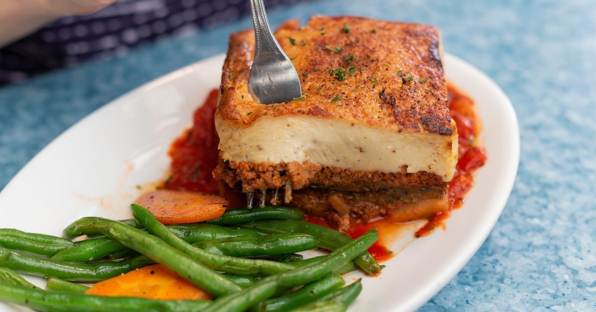 TavernaAgora's tweet photo. In the mood for some comfort food? Let us introduce you to our #Moussaka. An iconic and traditional #Greek dish of layered eggplant, seasoned beef and bechamel sauce. #GreekFood #Comfortfood #OPA! #TavernaAgora https://t.co/h7TO3obxcT