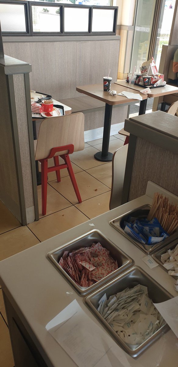 SamHaxton's tweet photo. @KFC_UKI "eat in or takeaway?".. not really an option to eat in when theres not a clean table in sight, still like this when we left (after having to eat outside). #Disgusting #Gross #KFC #YouShouldBeAshamed #CleanYourTables #KFCGlastonbury https://t.co/GWh8snw0E7