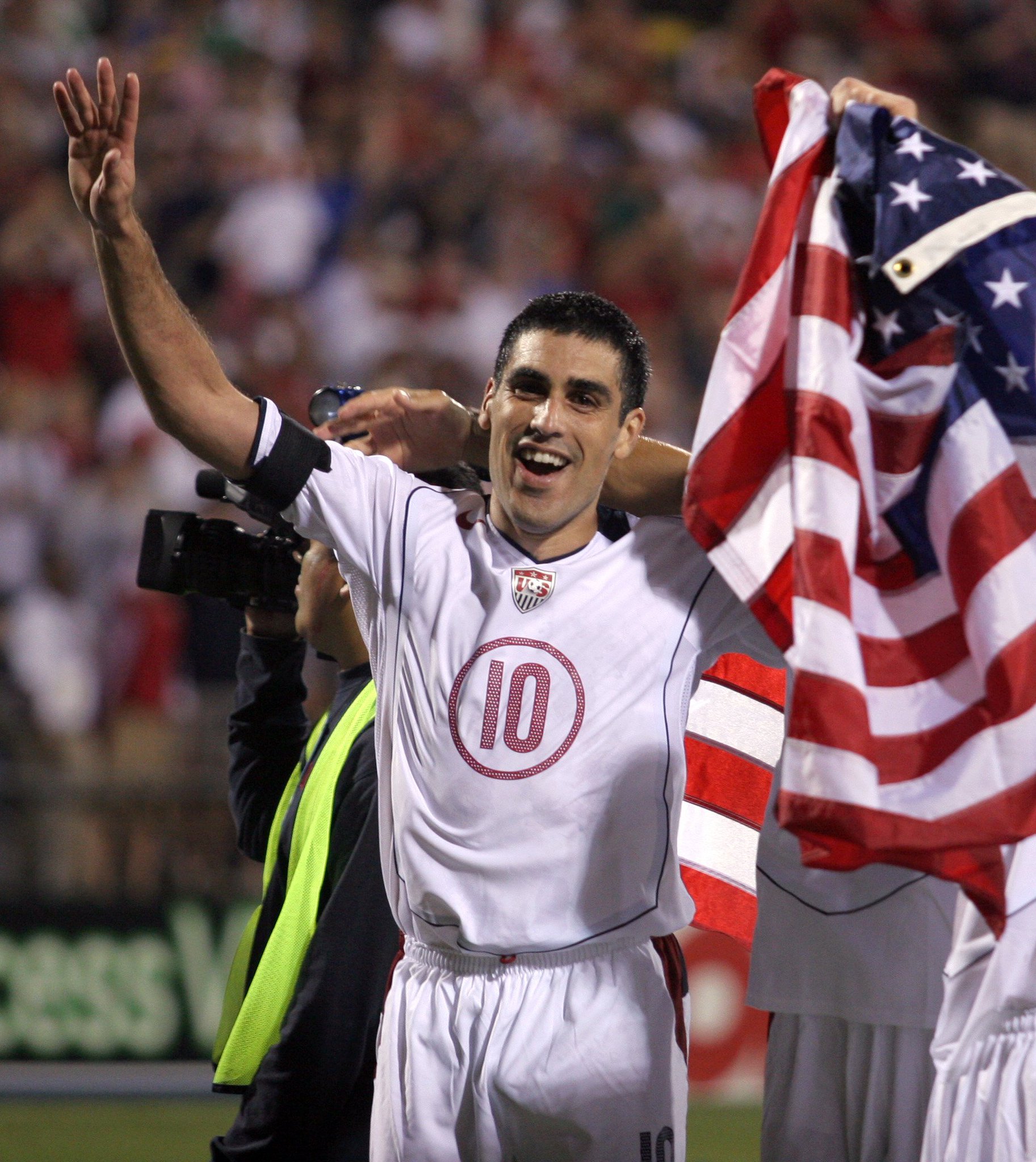 112  caps.
4 and wore the armband at 2 of them. 

Happy Birthday, Claudio Reyna! 