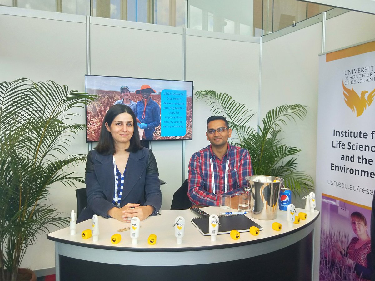 IACE_UniSQ's tweet photo. #USQResearchers @VaghefiNiloofar &amp; @NPuru1 at the booth &amp; on screen for this year's @AustSummerGrain 🌱Catch Niloofar's presentation tomorrow on tan spot on mungbean @usqedu #USQResearch #thinkingworks #ASGC19 #summercrops #crophealth https://t.co/5WQQuTAGRi