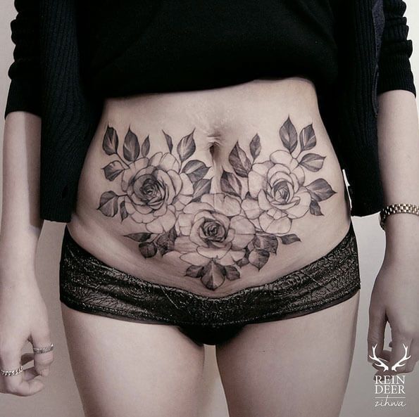 stomach tattoos for women to cover stretch marks