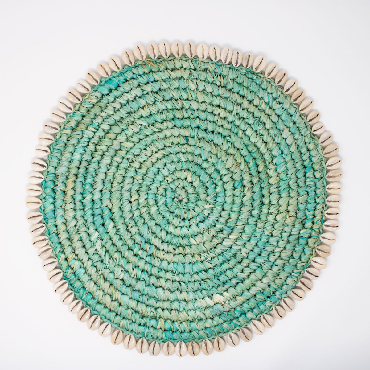 Simple and earthy, this wonderfully tactile placemat is hand-woven from sea grass and features cowrie shell edging. Perfect to add a touch of understated glamour to any table. 
#duskfurniture #homedecor #handwoven