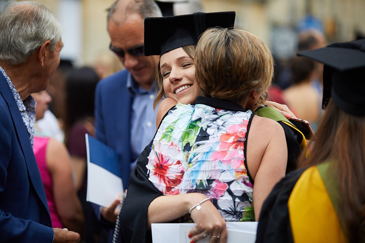 UniofBath's tweet photo. A day for big smiles and hugs at @TheatreRBath. 💙💛 

#BathGrads https://t.co/Zhx3GiH1dI